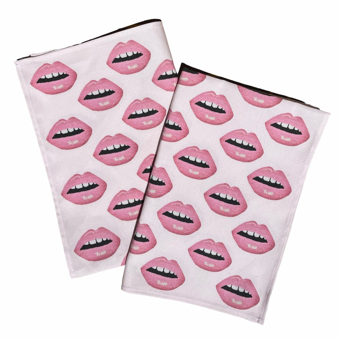linen-colored tea towel with soft pink lips covered all over it