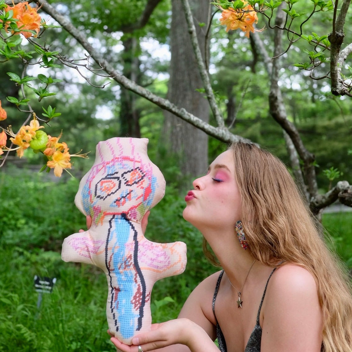 blonde model with abstract monster with big eyes & wild hair