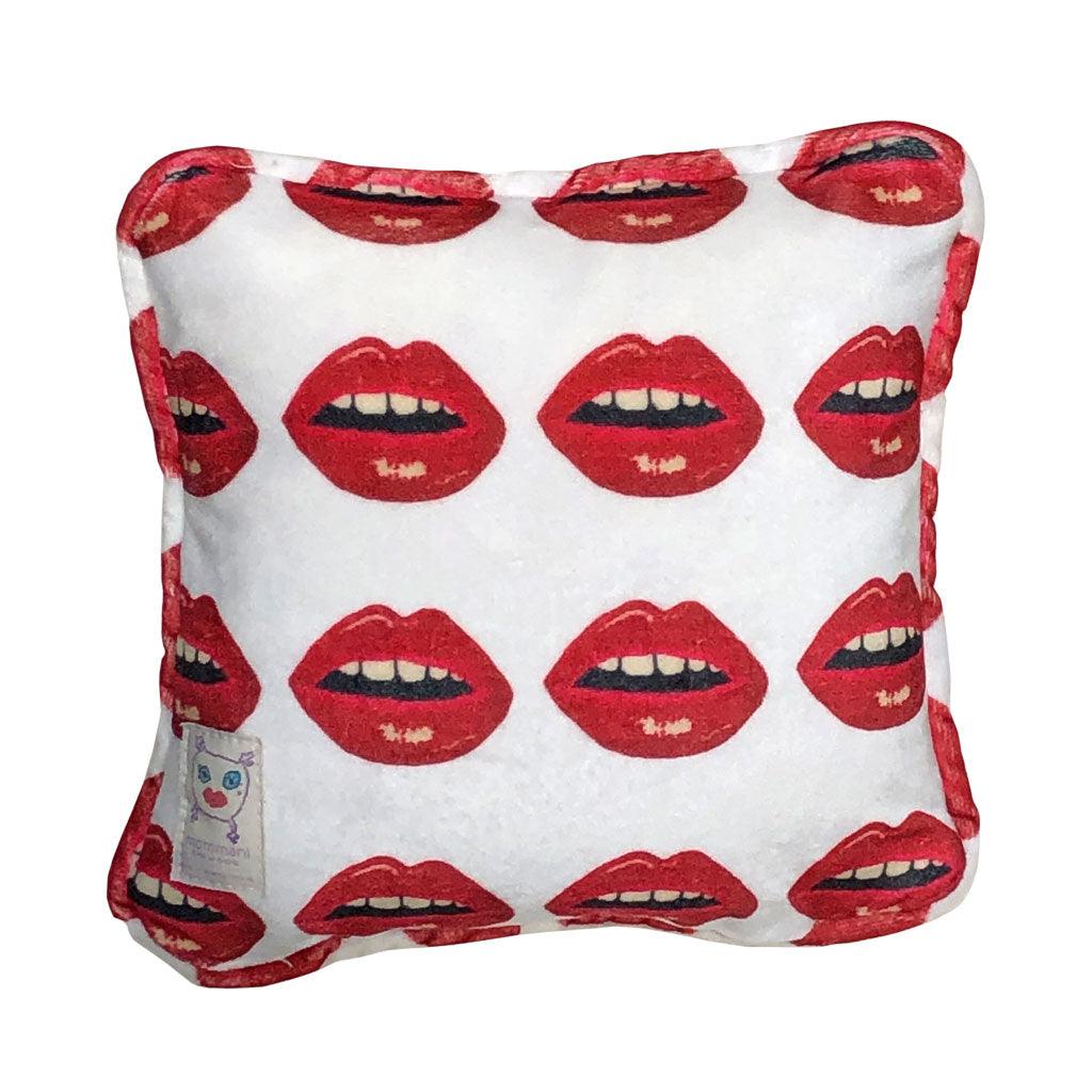 white velvet pillow with red lips pattern