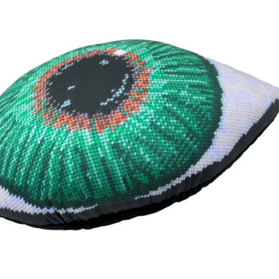 green eye sculpted pillow has gold at center, gradually turning to a dark green- very detailed