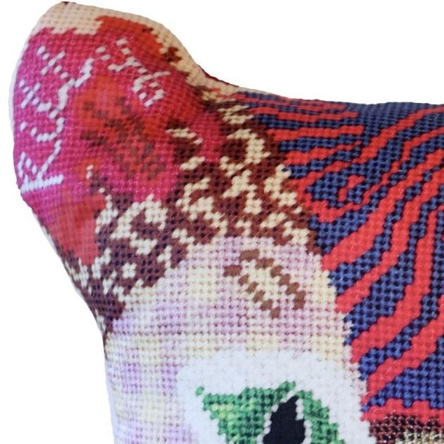 Multi-patterned sculpted cat in primarily pink and red colored with a checked face, swirls, leopard print , green eyes & flowers. Kitty Love is written on the ears.