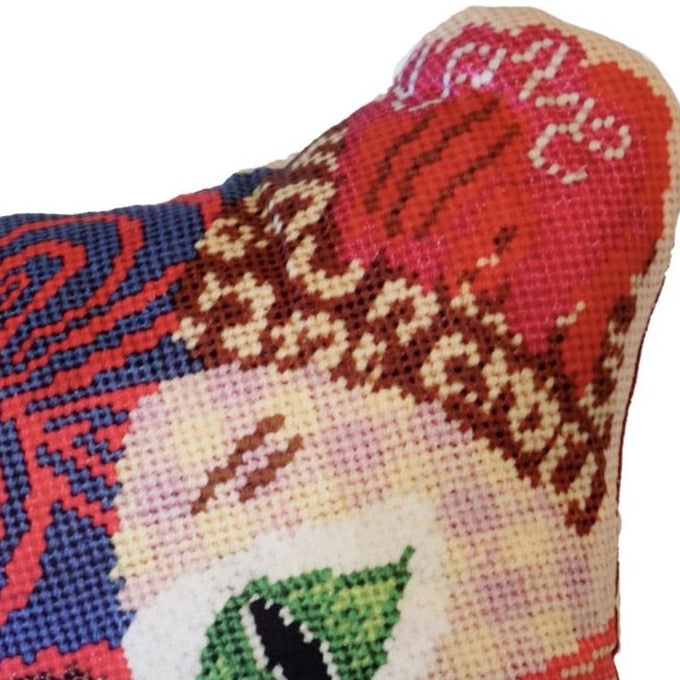 Multi-patterned sculpted cat in primarily pink and red colored with a checked face, swirls, leopard print , green eyes & flowers. Kitty Love is written on the ears.
