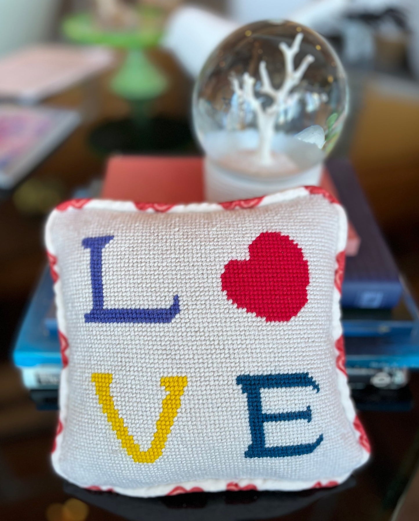 needlepoint LOVE with heart O on white silk background with velvet lips border