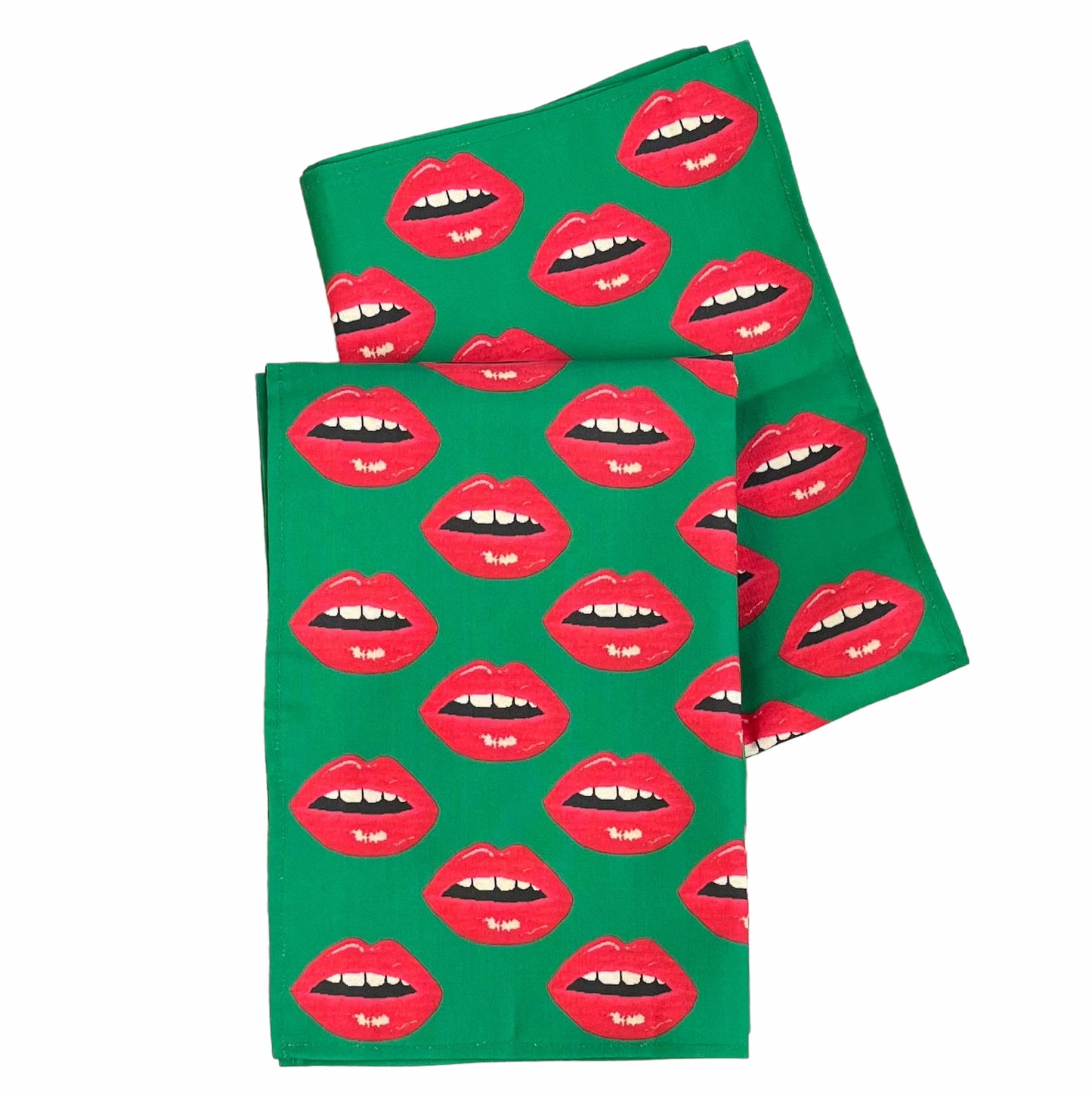 Christmas green tea towel covered in red lips