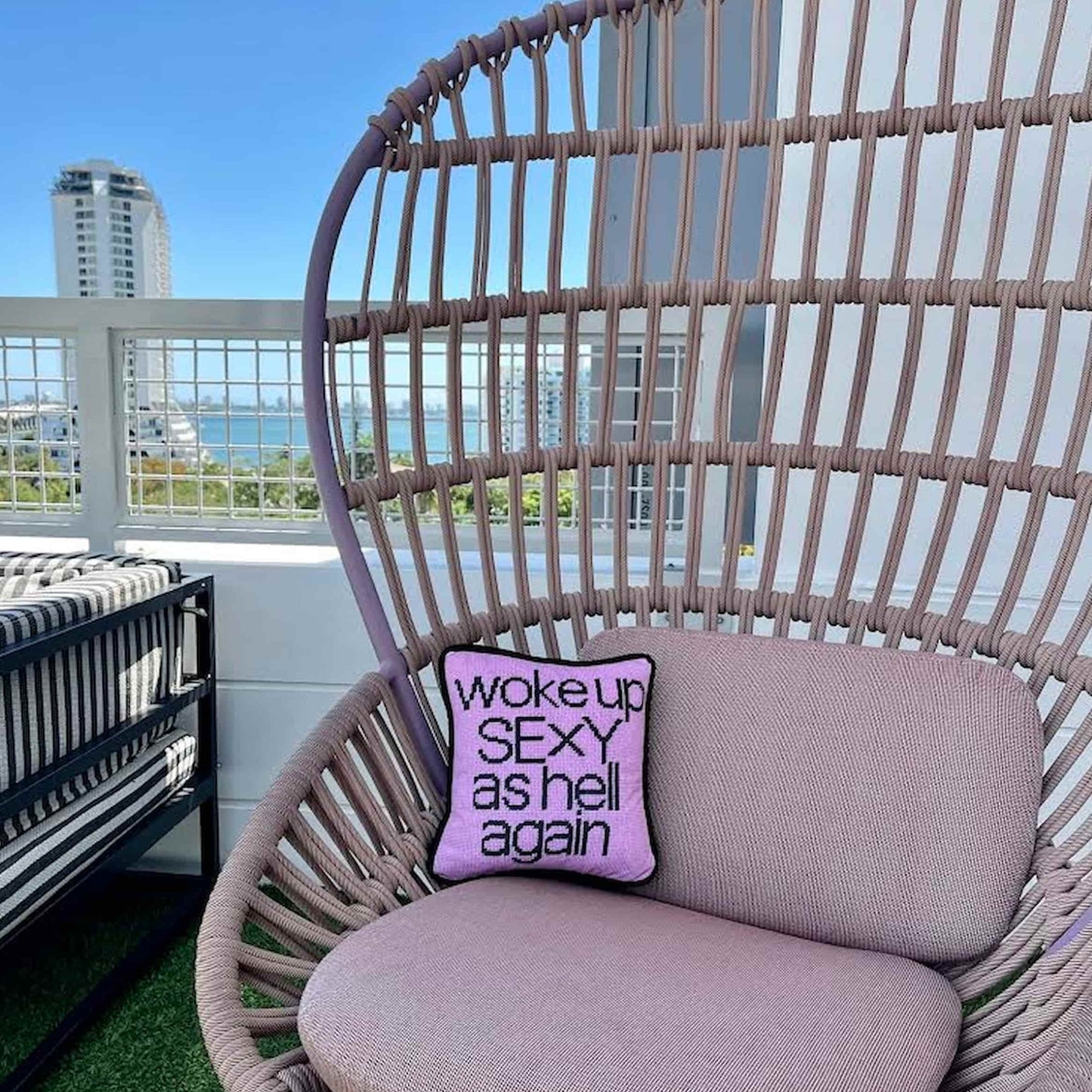 woke up sexy as hell in black, centered on pillow with pink background