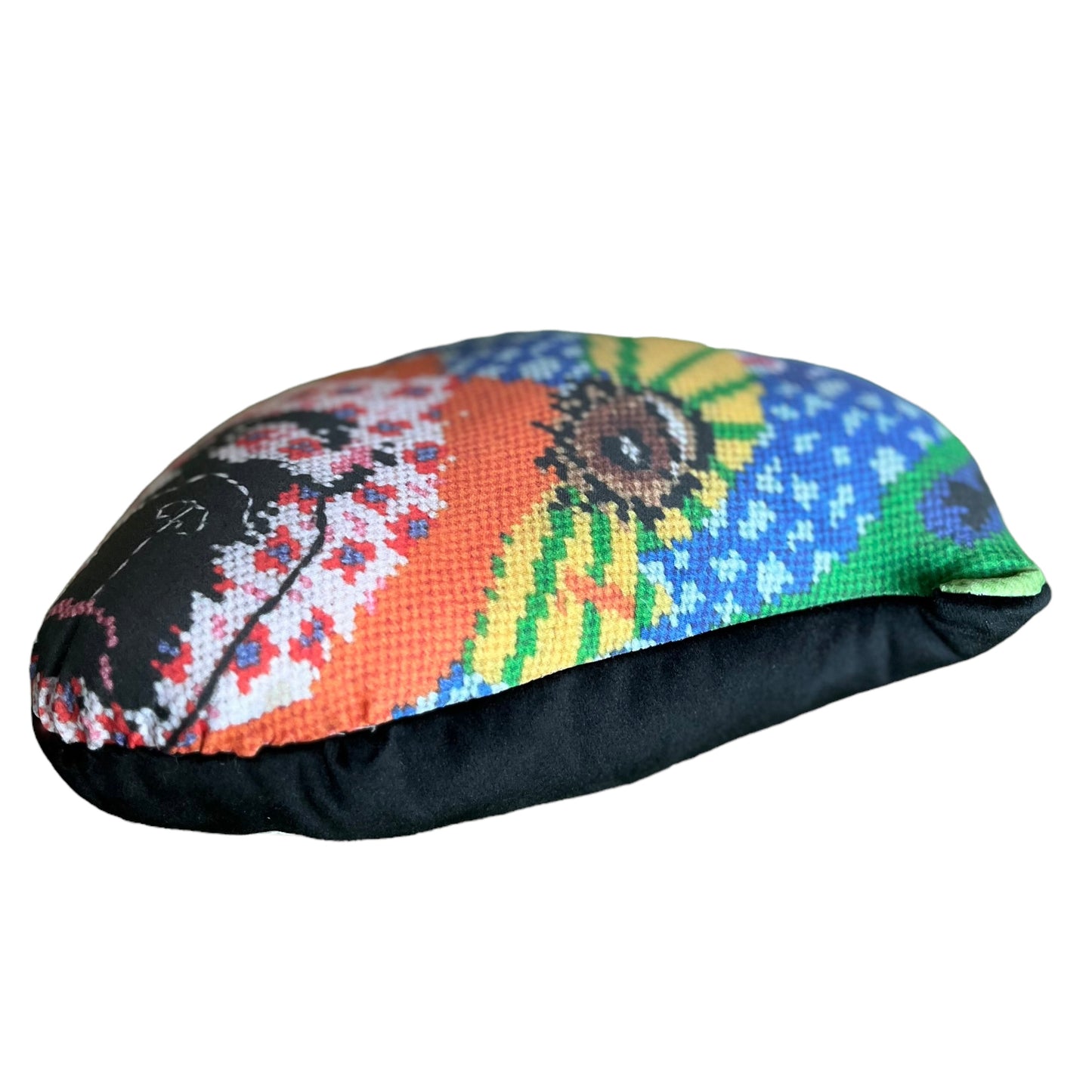 whimsical dog pillow with brown starry eyes, pink flowers, purple dots, pink flowers