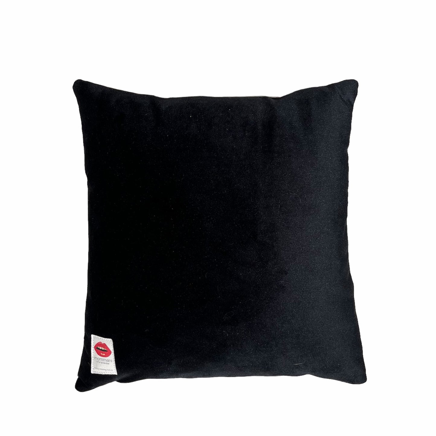 velvet pillow of doe-eyed girl with Jackie O hair and yellow hair clamp, blowing a bubble