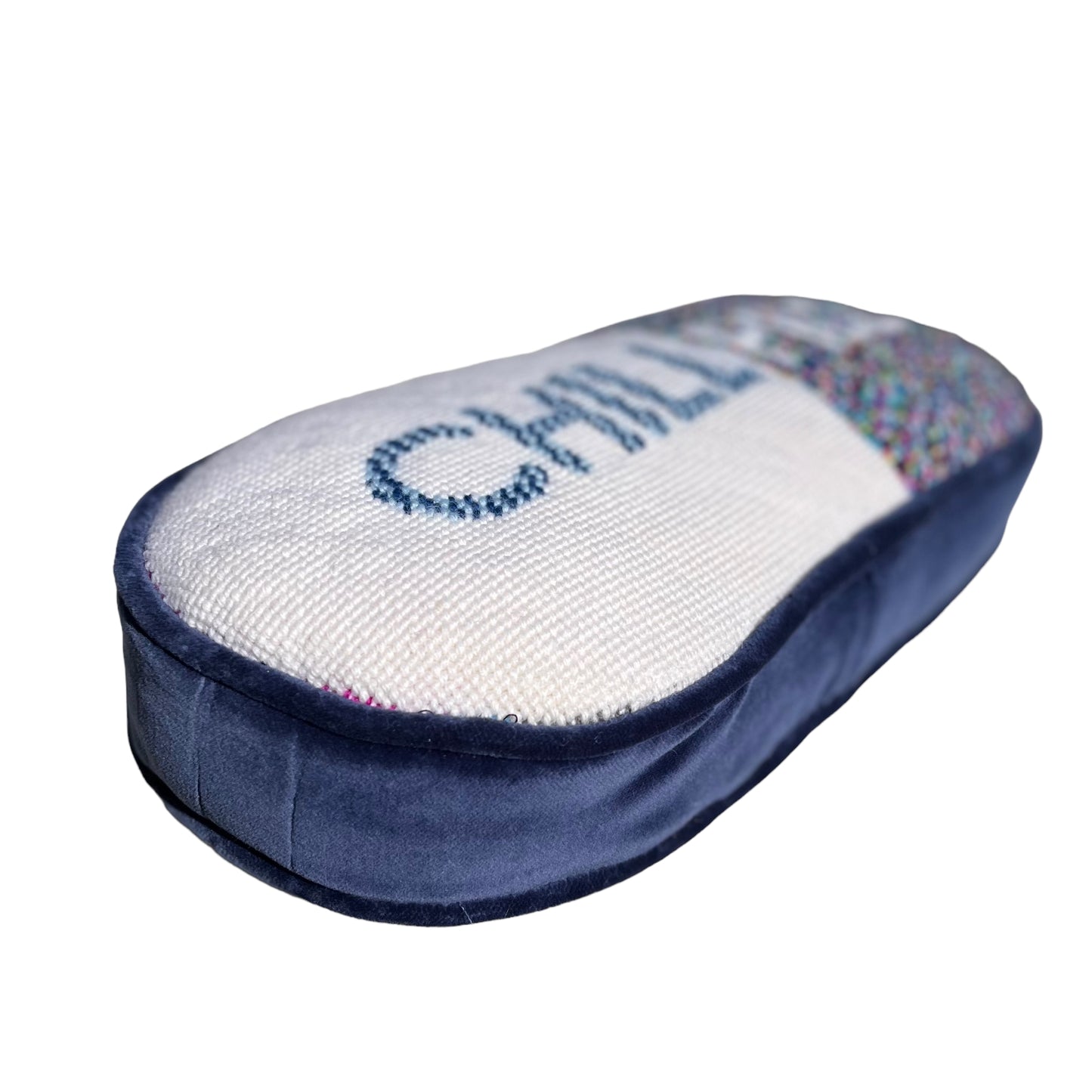 pill shaped pillow design is half white with blue CHILL & muti-colored dotted pattern PILL in white