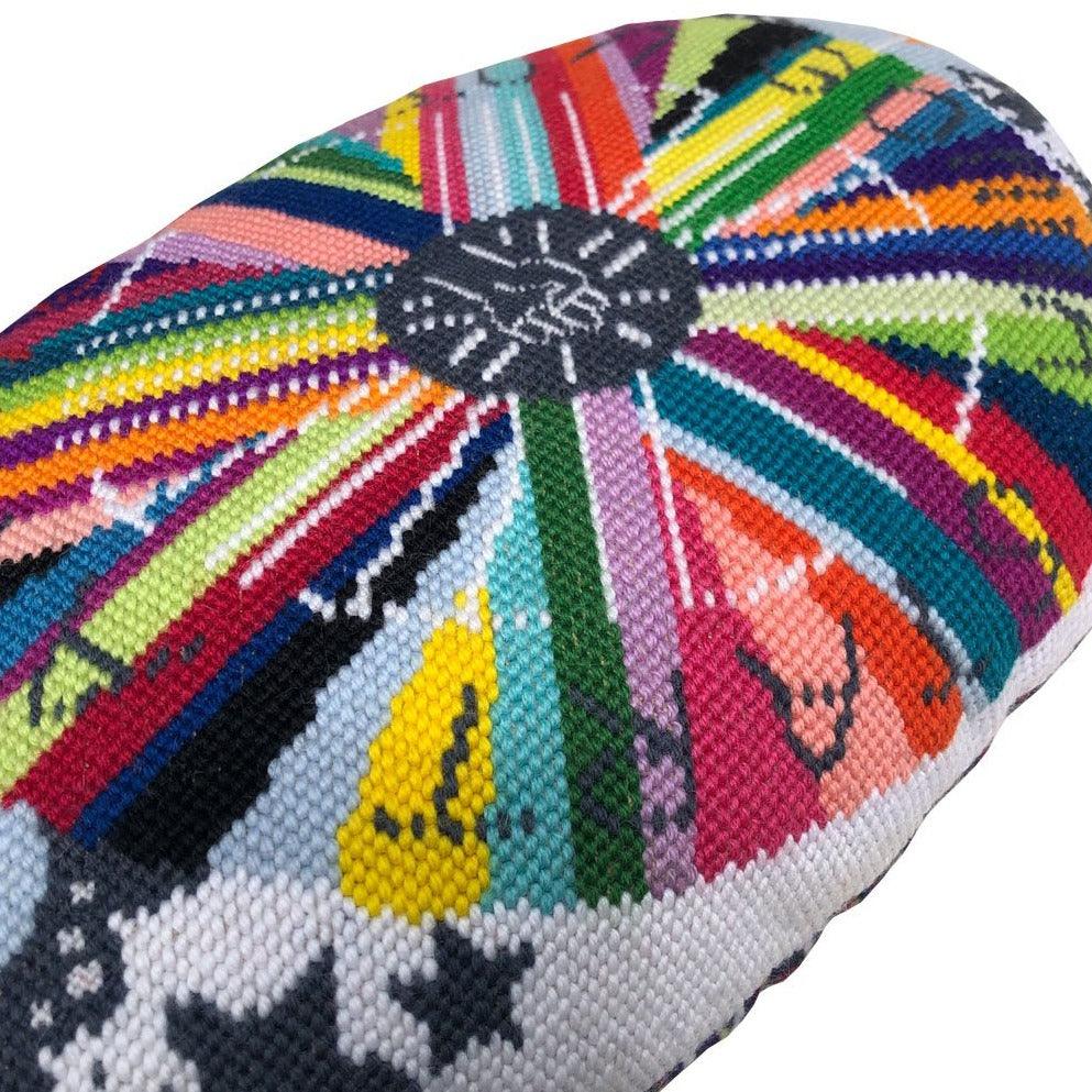 pillow center is dark gray with white fist pump, rainbow circle radiates out with GONNA START A REVOLUTION, cloud and stars border