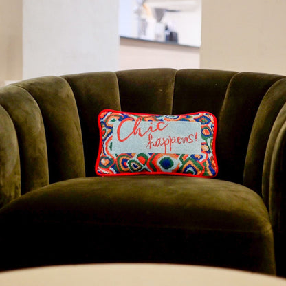 designer velvet pillow reads "Chic Happens" in red on Tiffany blue background with colorful red, green and blue  large paisley border
