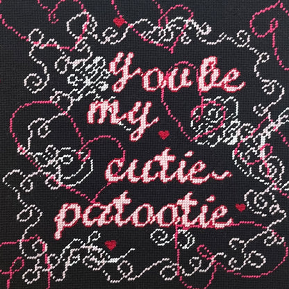 hand-embroidered needlepoint CUTIE-PATOOTIE pillow