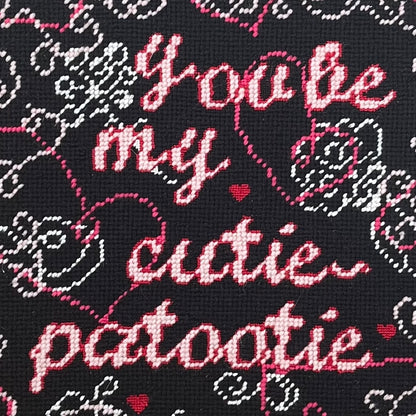 hand-embroidered needlepoint CUTIE-PATOOTIE pillow