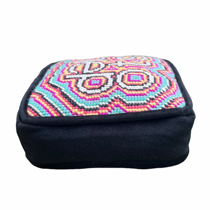 objet d'art pillow features psychedelic, colorful pattern with the word stoned in the center