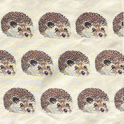 Tea towel with hedgehog pattern on a white background