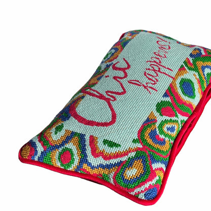 hand-embroidered needlepoint pillow features red, green, blue & gold paisley border with "Chic Happens!" written in red in the center