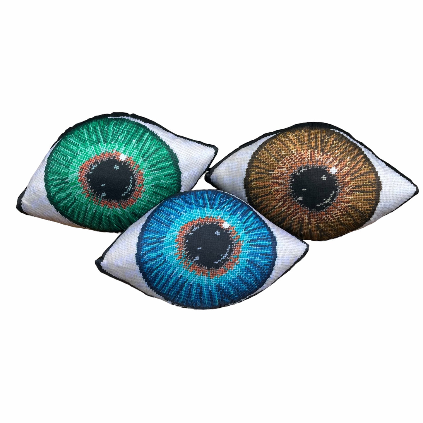 green, blue, and brown sculpted eye pillows