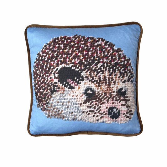 cute hedgehog with wildly colorful quills on a baby blue background with cocoa velvet finish