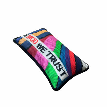 IN MOD WE TRUST sits in a white rectangular box with wavy color bands in background