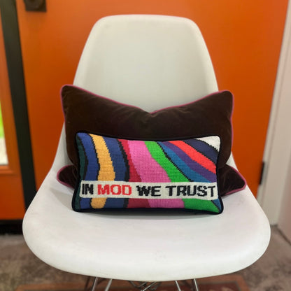 IN MOD WE TRUST sits in a white rectangular box with wavy color bands in backgroundIN MOD WE TRUST sits in a white rectangular box with wavy color bands in background