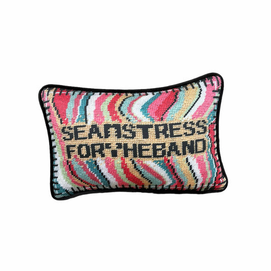 SEAMSTRESS FOR THE BAND black letters inside tan box, surrounded by wavy bands of turquoise, pink, red, white, lime and a keyboard border