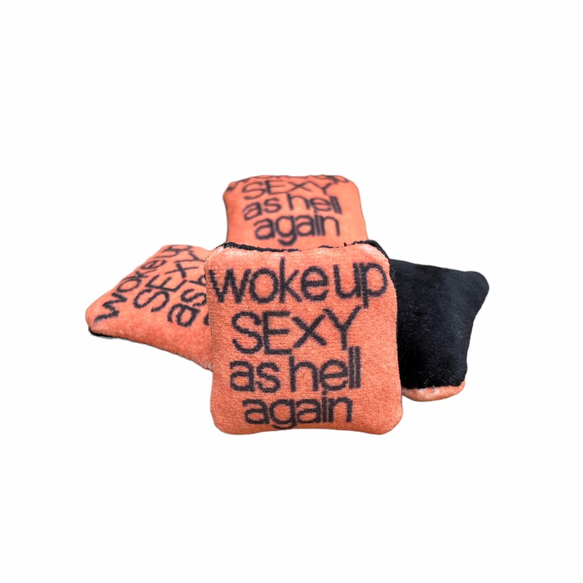 woke up sexy as hell again centered on pillow in black text with copper background