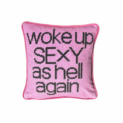 pink velvet with black script reading WOKE UP SEXY AS HELL AGAIN on full face of pillow