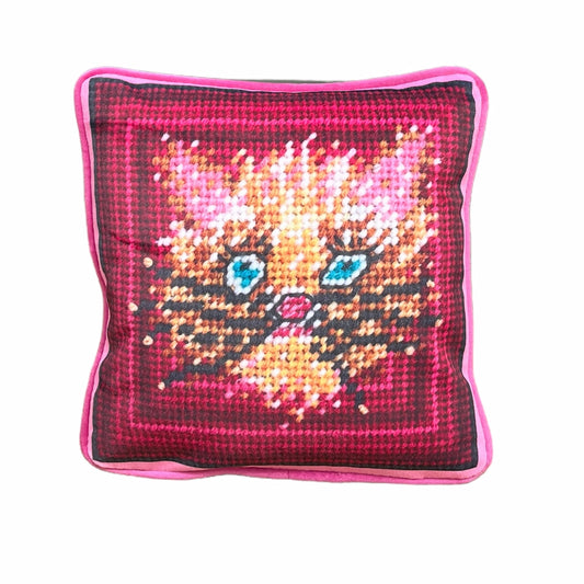 wild blue eyed cat in whimsical gold and pink with pinkish frame