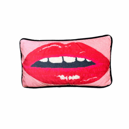 pink velvet lumbar pillow with red lips with open mouth and gapped teeth