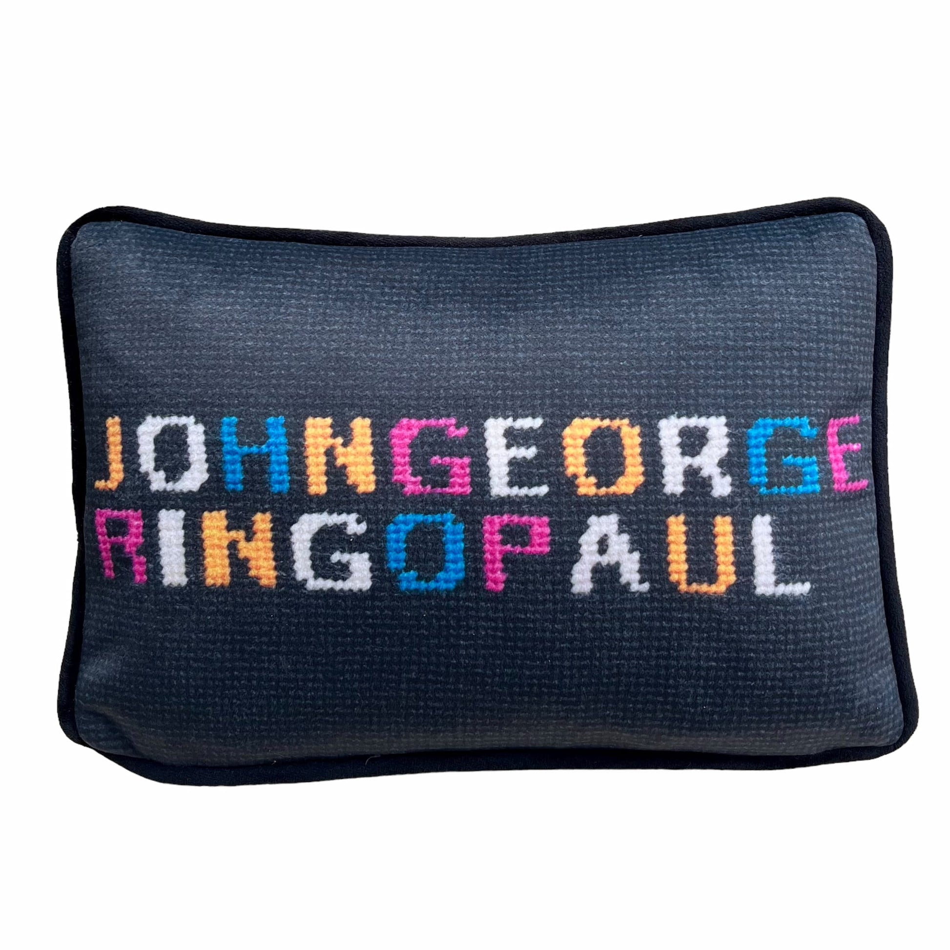 JOHNGEORGE on top line; RINGOPAUL written in colorful yellow, white, blue and pink letters on solid black background. The Beatles pillow.