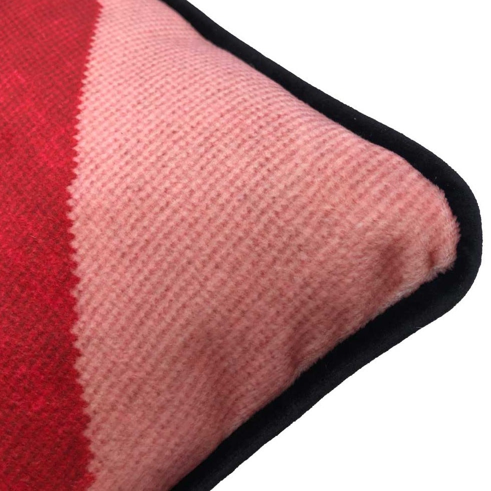 pink velvet lumbar pillow with red lips with open mouth and gapped teeth 