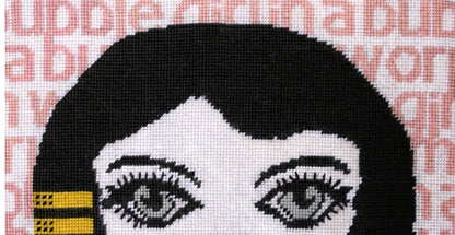 needlepoint big-eyed girl blowing pink bubble & hair flipped up, BUBBLE GIRL IN A BUBBLE GUM WORLD text behind image