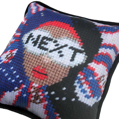 red, white & blue pillow with lady centered, flipped black hair, pearl necklace and sunglasses that say NEXT
