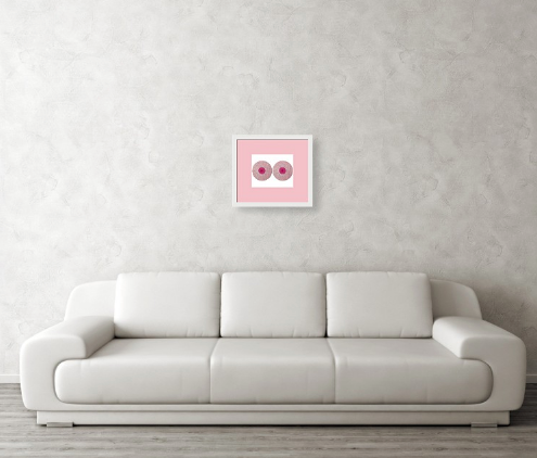 framed side-by-side baby pink rounds with hot pink centers, hung above white leather sofa