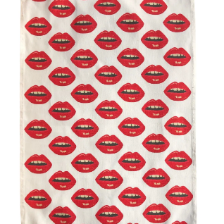 white tea towel covered  in rows of red lips scattered diagonally