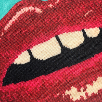 outdoor friendly square green pillow with big red lips