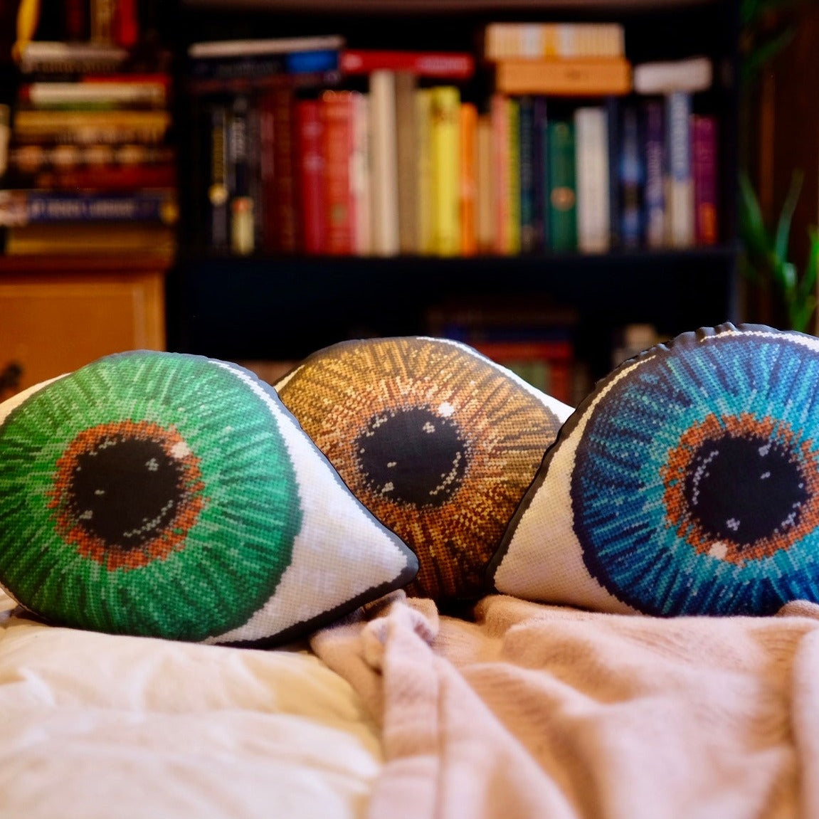 sculpted eye pillows have gold in centers, gradually turning to darker shades of blue, green & brown - very detailed