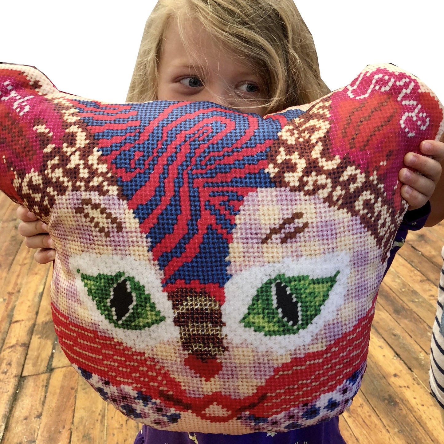 young girl with cat pillow
