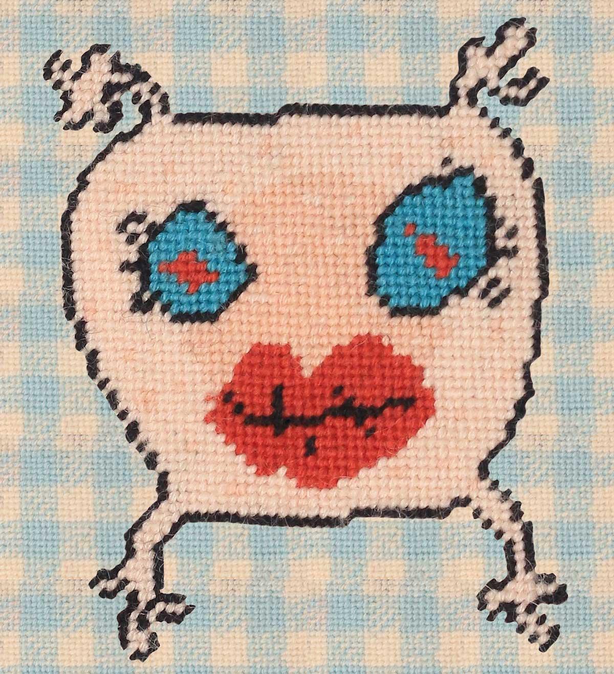 pillow with sweet, blue eyed monster & big lips on baby blue checked background