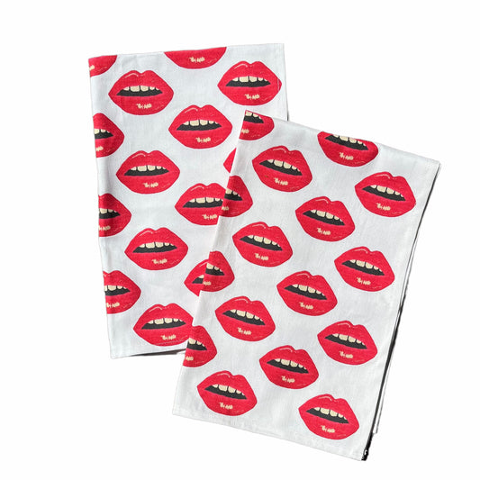 white cotton linen tea towel with red lips all over