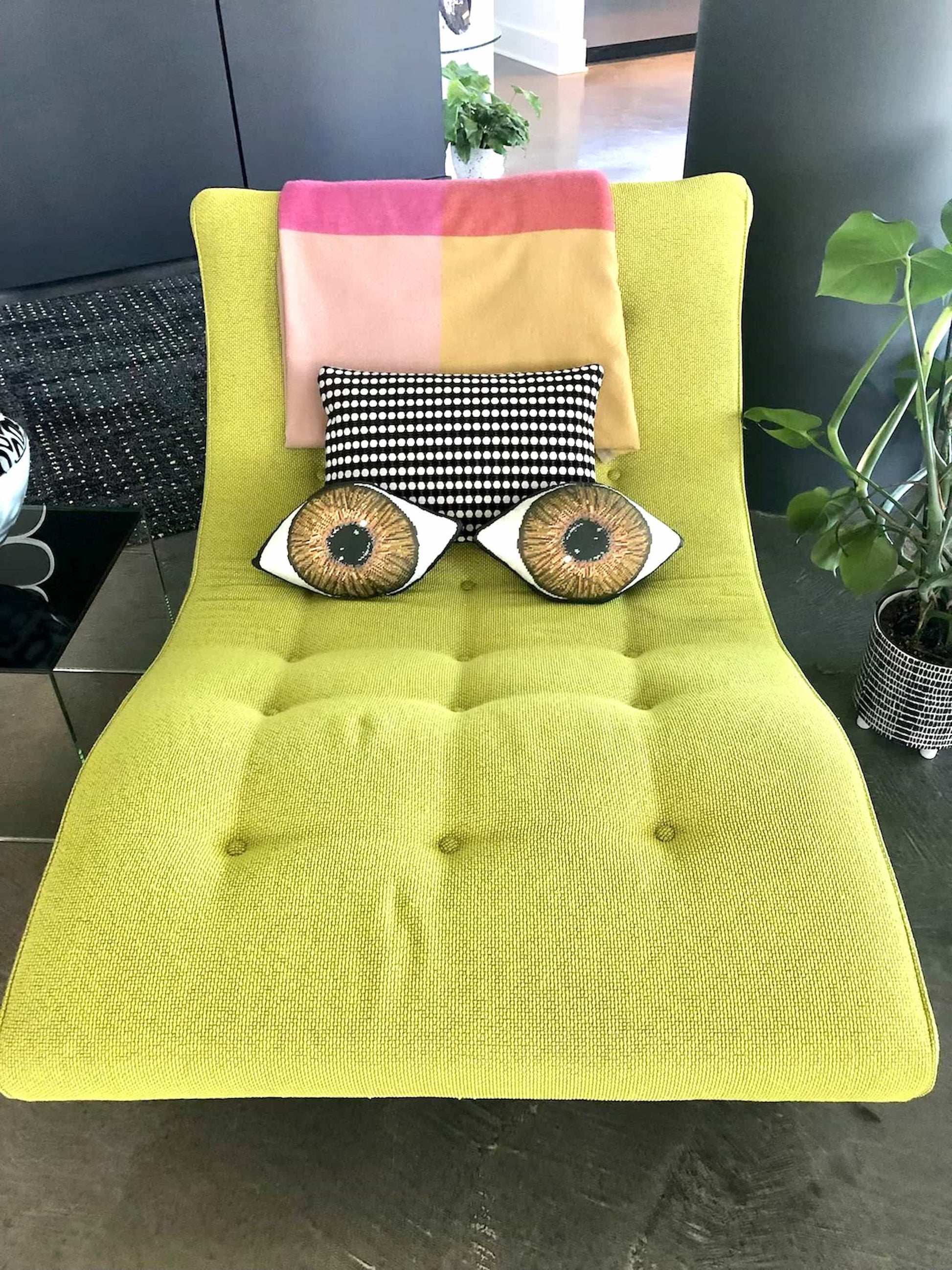 sculpted brown eye pillows shown on chartreuse chaise, Charlotte, NC