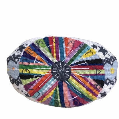 pillow center is dark gray with white fist pump, rainbow circle radiates out with GONNA START A REVOLUTION, cloud and stars border