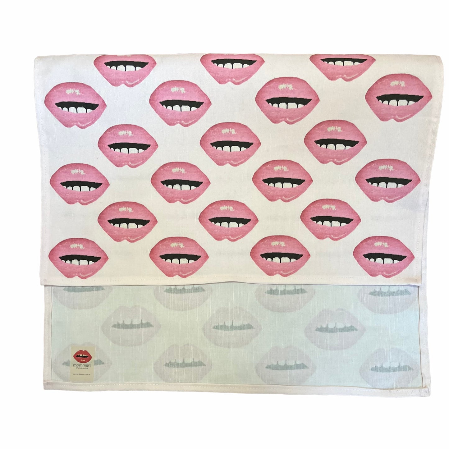 linen-colored tea towel with soft pink lips covered all over it