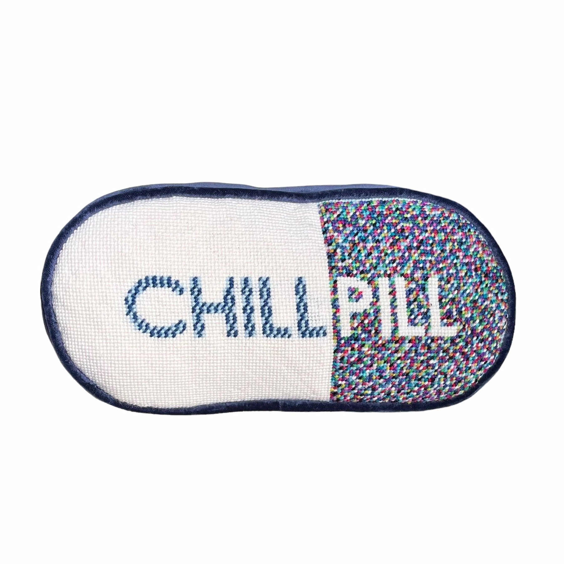 pill shaped pillow design is half white with blue CHILL & muti-colored dotted pattern PILL in white