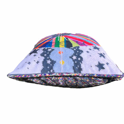 pillow center is dark gray with white fist pump, rainbow circle radiates out with GONNA START A REVOLUTION, cloud and stars border