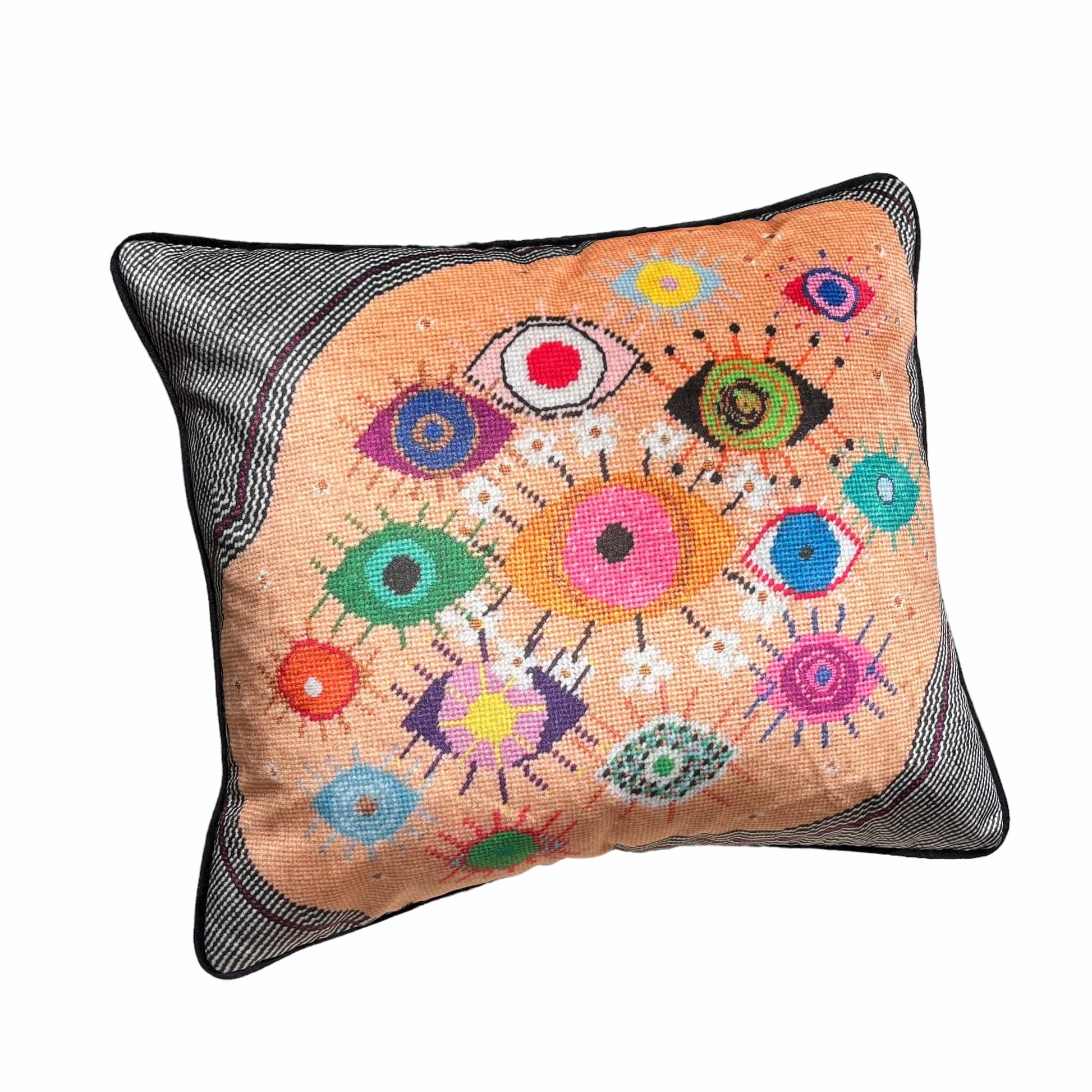 pillow covered in fanciful, brightly-colored, whimsical, fanciful eyes