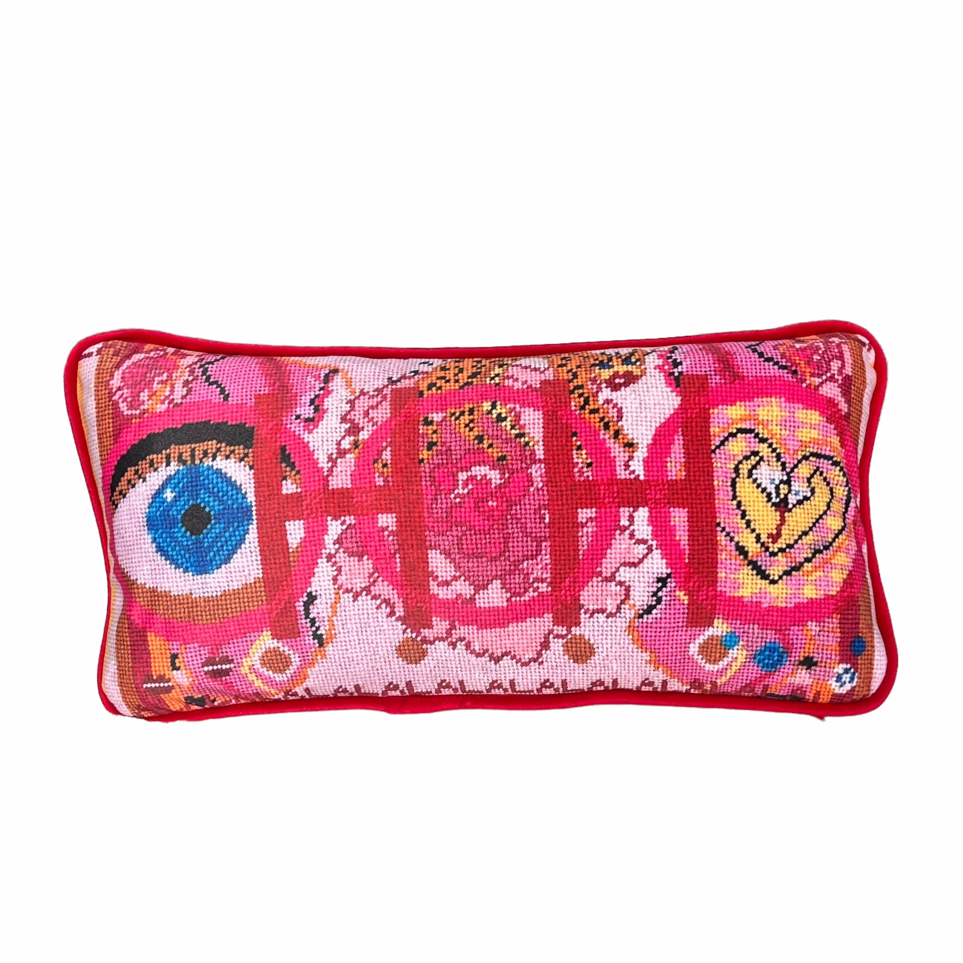 velvet pillow with pink and red colorful pattern, blue eye, cheetah, heart snakes, roses and lettering OOH in center with a LA LA LA border 