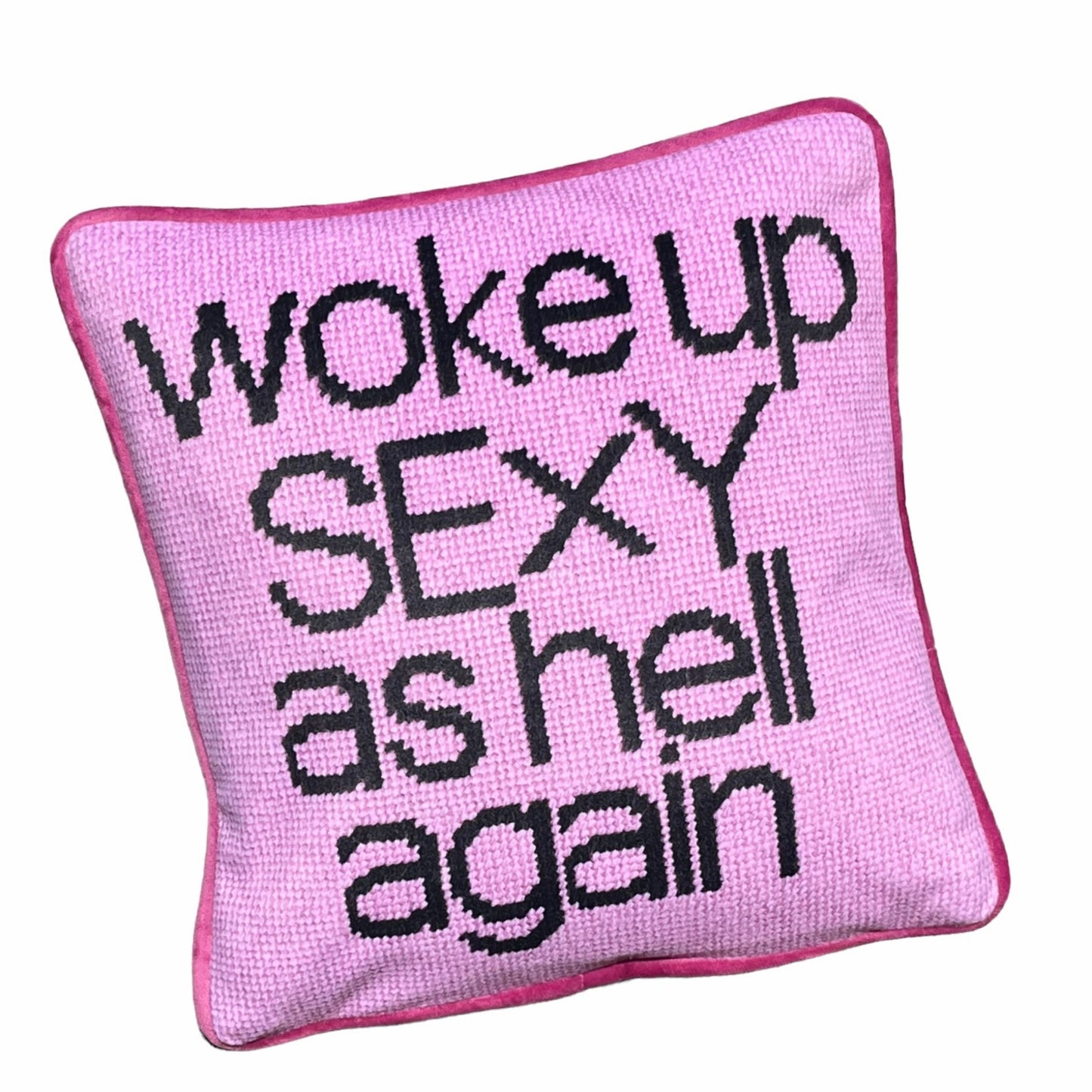 pink velvet with black script reading WOKE UP SEXY AS HELL AGAIN on full face of pillow