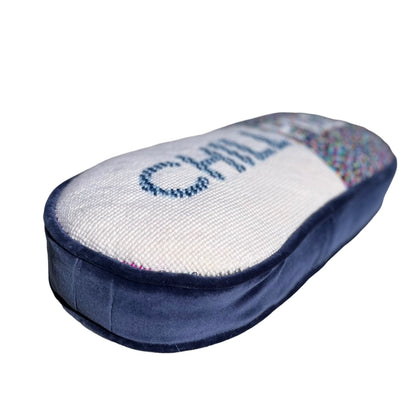 pill shaped pillow design is half white with blue CHILL & muti-colored dotted pattern PILL in white
