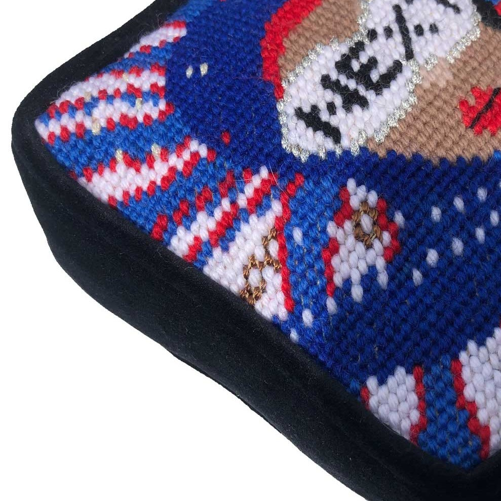 needlepoint red, white & blue pillow with lady centered, flipped black hair, pearl necklace and sunglasses that say NEXT