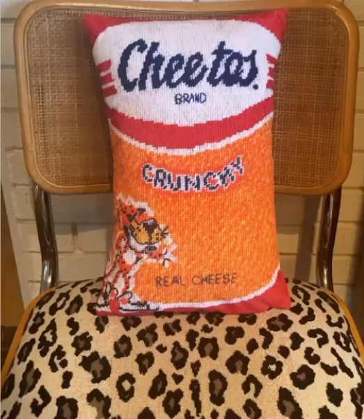 Cheetos pillow with crunchy logo & Chester on leopard chair